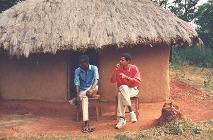 Barack Obama smoking with a relative
Undated collect photo of Barack Obama smoking in front his family's hut in Kenya, Africa
Quitting smoking just before heading into the most stressful period of your life is no easy task to do. But that is exactly what Barack Obama attempted to do before launching his presidential campaign. Considering the months of campaigning and constant pressure it is little surprise that the now president-elect found the task a difficult one - allegedly giving into temptation on several occasions. However, the soon to be president is now apparently nicotine free after winning the battle. The then senator first announced his decision to quit in 2007, in order to please his wife Michelle, while on the David Letterman Show. Of course how he appeared to the American public, who might be wary of a President addicted to cigarettes, was no doubt powerful motivation too.