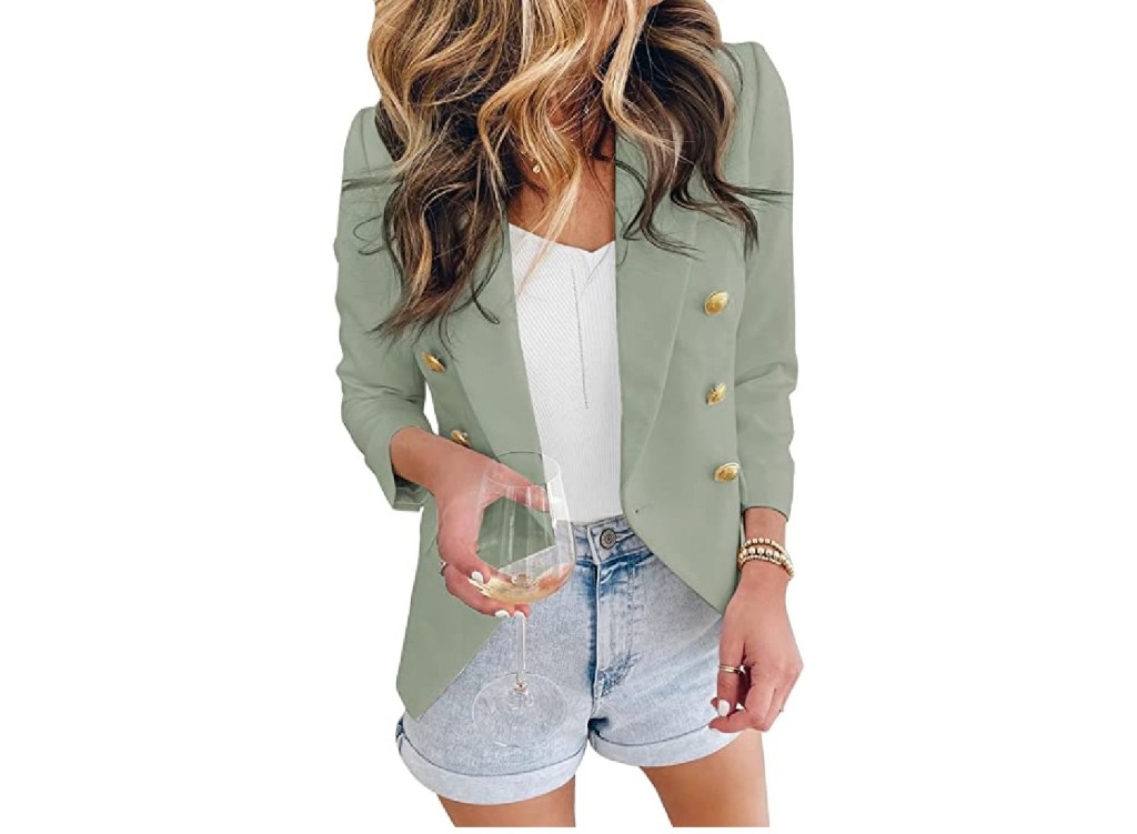 A model wearing a green blazer.