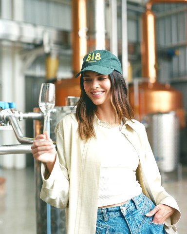 Kendall Jenner’s 818 Tequila dropped a merch collection on 11/30 to help support sustainability efforts and nonprofit partner S.A.C.R.E.D. Instead of a traditional merch drop, 818 Tequila is continuing their mission of giving back to the planet with purchases helping to support 818 Tequila’s sustainability efforts and ongoing partnership with S.A.C.R.E.D., a US-based nonprofit that supports rural Mexican communities where heirloom agave spirits are made. About 818 Tequila’s Merch Drop: Giveback: Purchases will help support 818 Tequila’s sustainability efforts and partnership with nonprofit partner S.A.C.R.E.D. Items: The limited-edition collection includes 818 Tequila t-shirts, hats and socks along with season items including a puffer jacket, beanie, crewneck sweatshirt and sweatpants. Availability: Available until sold out. 30 Nov 2021 Pictured: Kylie Jenner. Photo credit: Courtesy of 818 Tequila/MEGA TheMegaAgency.com +1 888 505 6342 (Mega Agency TagID: MEGA812051_001.jpg) [Photo via Mega Agency]