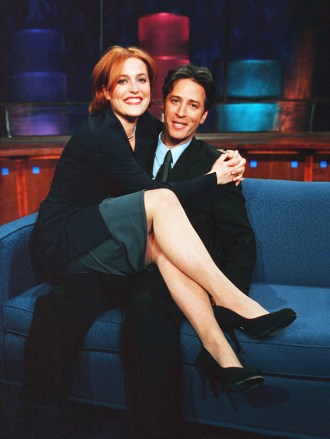 Editorial use only. No book cover usage.Mandatory Credit: Photo by Comedy Cent/Mad Cow Prod/Kobal/Shutterstock (5882628n)Gillian Anderson, Jon StewartThe Daily Show - 1996Comedy Cent/Mad Cow ProdUSATelevision