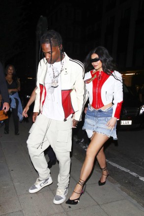 London, UNITED KINGDOM - Kylie Jenner and Travis Scott are the perfect unit as they coordinate outfits for a night out at The 22 in London, UK.  Pictured: Kylie Jenner, Travis Scott BACKGRID USA 7 AUGUST 2022 BYLINE MUST READ: Old Boy's Club / BACKGRID USA: +1 310 798 9111 / usasales@backgrid.com UK: +44 208 344 2007 / uksales@backgrid.com *UK Clients - Pictures Containing Children Please Pixelate Face Prior To Publication*