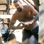 *EXCLUSIVE* Jason Momoa works Shirtless on his vintage motorcycles in Malibu after delivering tree to ex Lisa as couple are reportedly spending holidays together.