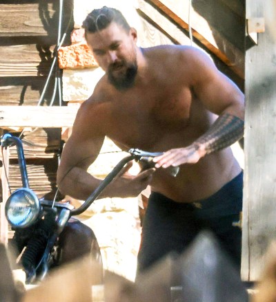 Malibu, CA  - *EXCLUSIVE*  - Actor Jason Momoa goes shirtless as he works on his vintage motorcycles in Malibu. The Aquaman star was seen with his hair pulled backin a pair of shorts and no shirt as he tightened the handlebars on his bike. Jason was recently spotted delivering a Christmas tree to ex Lisa Bonet. According to recent reports Jason is expected to spend part of the holiday together with Lisa with whom he shares 15-year-old daughter Lola and 13-year-old son Nakoa-Wolf.Pictured: Jason MomoaBACKGRID USA 22 DECEMBER 2022 BYLINE MUST READ: RMBI / BACKGRIDUSA: +1 310 798 9111 / usasales@backgrid.comUK: +44 208 344 2007 / uksales@backgrid.com*UK Clients - Pictures Containing ChildrenPlease Pixelate Face Prior To Publication*
