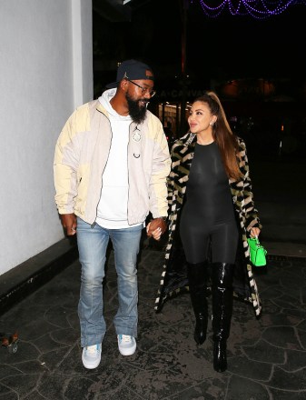 EXCLUSIVE: 'Real Housewives of Miami' star, Larsa Pippen dressed in Versace looks smitten with much younger boyfriend and Marcus Jordan as they held hands and smiled while out on a date night at 'E-Baldi' Italian Restaurant in Beverly Hills, CA. 28 Dec 2022 Pictured: Larsa Pippen, Marcus Jordan. Photo credit: MEGA TheMegaAgency.com +1 888 505 6342 (Mega Agency TagID: MEGA929021_011.jpg) [Photo via Mega Agency]