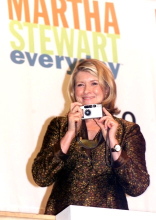 STEWART Martha Stewart, chairman and CEO of Martha Stewart Omnimedia Inc., takes pictures from the bell podium of the New York Stock Exchange before ringing the opening bell, . Kmart Corp. and Martha Stewart Living Omnimedia, Inc. today announced that they have signed a new long-term merchandising agreement that will significantly lengthen the term and expand the scope of the Martha Stewart Everyday brand of home and garden related products. Under the terms of the agreement, her products will continue to be available exclusively at more than 2,100 Kmart stores, and online at until 2008 with conditional renewal until 2013WALL STREET KMART MARTHA STEWART, NEW YORK, USA