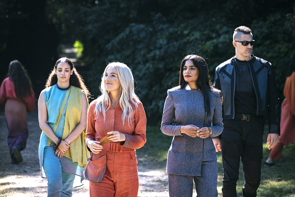 Ayelet Zurer as Maite Voss, Amarna Karan as Indira Mare, Joe Manganiello as Tomm and Yazzmin Newell as Sonda Crux - Moonhaven _ Season 1, Episode 1 - Photo Credit: Szymon Lazewski/AMC+