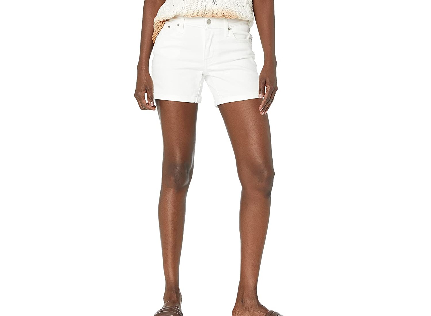 A pair of white, denim shorts.
