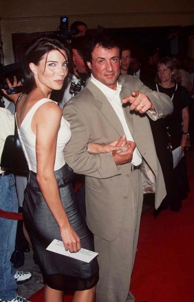 SYLVESTER STALLONE AND JENNIFER FLAVINWORLD PREMIERE OF 'CONTACT' IN LOS ANGELES, AMERICA, 1997.