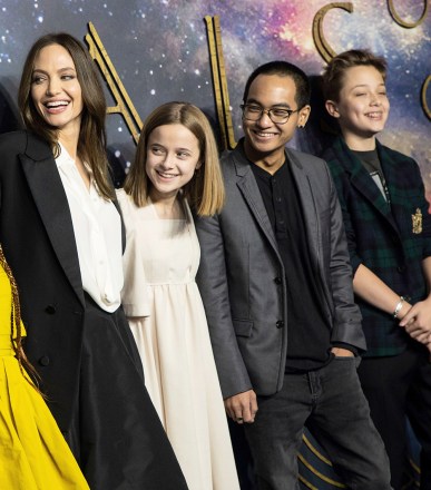 Shiloh Jolie-Pitt, from left, Zahara Jolie-Pitt, Angelina Jolie, Vivienne Jolie-Pitt, Maddox Jolie-Pitt and Knox Jolie-Pitt pose for photographers upon arrival at the premiere of the film 
