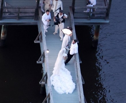 Savannah, GA - *premium-exclusive* - and the bride wore ... white.  Jennifer Lopez wears a stunning white wedding dress as she celebrates her wedding to Ben Affleck, fitting into a white jacket and black pants.  The couple kissed and posed for photos on Saturday evening before celebrating their union with their love and family and a raft of A-list friends around Ben's $8 million Georgia mansion.  The couple's children, all from their newly blended family, were also spotted on their way to Ben's plantation-style home, with two boys, J Lo, now Jennifer Affleck, taking the incredible train.  Image: Ben Affleck and Jennifer Lopez Backgrid USA 20 August 2022 USA: +1 310 798 9111 / usasales@backgrid.com UK: +44 208 344 2007 / uksales@backgrid.com * UK Customers - Pictures featuring children Please face first Pixelate Publication*