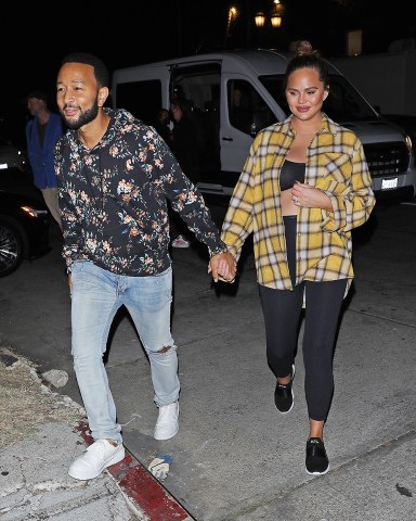 Los Angeles, CA  - *EXCLUSIVE*  - A pregnant Chrissy Teigen and John Legend hold hands as they are spotted leaving a film photoshoot in Los Angeles. The 36-year-old pregnant model is wearing black spandex with a matching black top and a yellow flannel dress shirt.

Pictured: Chrissy Teigen, John Legend

BACKGRID USA 18 OCTOBER 2022 

USA: +1 310 798 9111 / usasales@backgrid.com

UK: +44 208 344 2007 / uksales@backgrid.com

*UK Clients - Pictures Containing Children
Please Pixelate Face Prior To Publication*