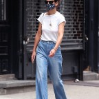 Actress Katie Holmes Is Seen Wearing A Face Mask, High-waisted Jeans And White T-Shirt With Her Hair Up In A Bun In Nolita In New York City