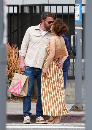 Ben Affleck and Jennifer Lopez share a kiss while shopping in Los Angeles. May 20, 2023 Pictured: Ben Affleck and Jennifer Lopez. Photo credit: Thecelebrityfinder /MEGA TheMegaAgency.com + 1 888 505 6342 (Mega Agency TagID: MEGA984345_001.jpg) [Photo via Mega Agency]