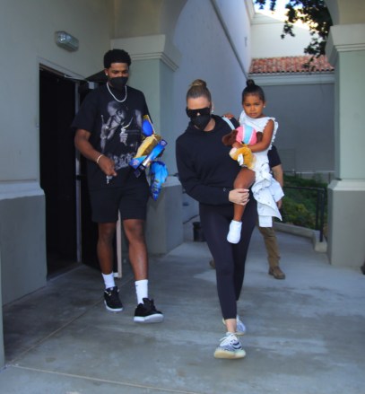PREMIUM EXCLUSIVE: Khloe Kardashian and Tristan Thompson take daughter True to sister Kim's Paw Patrol premiere as rumors continue about them rekindling their romance. The on-off couple looked happy and relaxed as they joined members of the Kardashian clan for the private screening. Khloe and pro basketball player Tristan were first linked in 2016 when they were spotted spending time together at a nightclub, and they later took a vacation in Mexico. The two confirmed that they were dating that same year and remained very close through much of 2017. The reality television personality eventually confirmed that she was pregnant with the athlete's child that December through a post made to her Instagram account. Kardashian revealed that she was expecting a girl during an episode of Keeping Up With The Kardashians that aired the following year. In 2018, it was reported that Thompson was spotted kissing multiple women in several locations, which surprised the clothing designer. That year, she gave birth to True, and the parents later reconciled following the child's birth. Although the two appeared to be going strong in their new roles as parents, the basketball player, just traded to the Sacramento Kings in California, was later caught cheating with several other women, and the two split up in February of 2019. The pair appeared to mend their relationship over the course of that year and were reportedly on good terms by the beginning of 2020. The parents quarantined together during the early stages of the pandemic, and their romance was eventually resumed last August. Earlier this year, it was reported that the couple was planning on expanding their family in the future, although no solid plans have been revealed as of yet. This past June, it was revealed that Kardashian and Thompson had separated, although they were said to still be on good terms at the time of their split. 12 Aug 2021 Pictured: Tristan Thompson, Khloe Kardashian and daughter True. Photo credit: MEGA Th