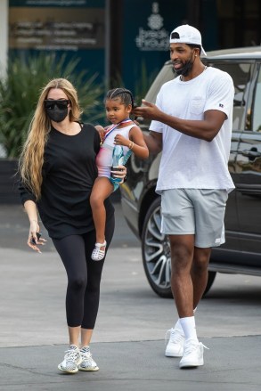Calabasas, CA  - *EXCLUSIVE*  - Khloe Kardashian and Tristan Thompson were seen meeting up once again to co-parent their adorable daughter True, at dance class. The couple seemed at ease in each other's company after a rocky few months in which Tristan faced new cheating allegations. Khloe dressed casually in black leggings and a black top carried True before Tristan took her and carried her in to the class.Pictured: Khloe Kardashian, Tristan Thompson, True ThompsonBACKGRID USA 17 AUGUST 2021 BYLINE MUST READ: IXOLA / BACKGRIDUSA: +1 310 798 9111 / usasales@backgrid.comUK: +44 208 344 2007 / uksales@backgrid.com*UK Clients - Pictures Containing ChildrenPlease Pixelate Face Prior To Publication*