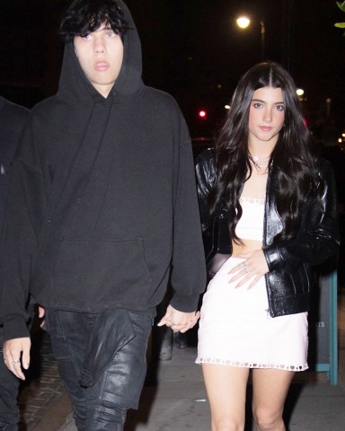 Landon Barker holds hands with rumored new girlfriend, TikTok star Charli D'Amelio as they leave Machine Dun Kelly's Madison Square Garden afterparty at Catch Steakhouse in New York. The rumored couple were joined by Charli's older sister and fellow TikTok star Dixie.  Landon's father, Travis Barker was rushed to hospital in LA for an unknown illness.Pictured: Landon Barker,Charli D'AmelioRef: SPL5322685 290622 NON-EXCLUSIVEPicture by: WavyPeter / SplashNews.comSplash News and PicturesUSA: +1 310-525-5808London: +44 (0)20 8126 1009Berlin: +49 175 3764 166photodesk@splashnews.comWorld Rights