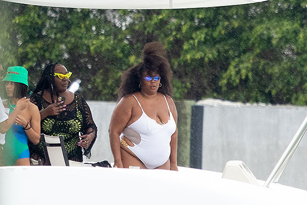 Lizzo Shares Sexy Beachside Bikini Pics, Calls Herself A 'Roll