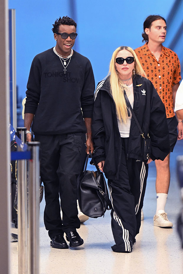 Madonna's in Louis Vuitton's Funky Sandals, Tracksuit at JFK