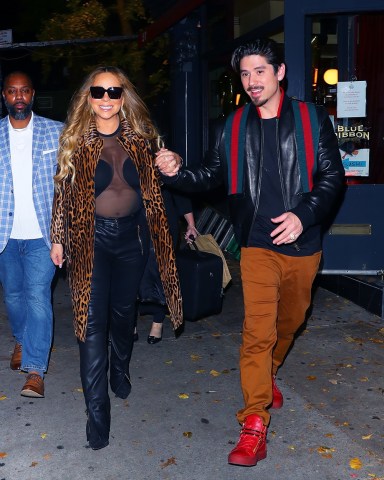 New York, NY  - *EXCLUSIVE*  - Mariah Carey & Brian Tanaka were spotted hand in hand leaving Blue Ribbon Sushi after a random and surprisingly exciting run-in with rapper Lil Durk who hung out with the couple for a while before heading to Teterboro airport. They all took greeted each other, laughed, did shots, and took personal photos before parting ways. **SHOT ON 11/07/2022**Pictured: Mariah Carey, Brian TanakaBACKGRID USA 8 NOVEMBER 2022 BYLINE MUST READ: BlayzenPhotos / BACKGRIDUSA: +1 310 798 9111 / usasales@backgrid.comUK: +44 208 344 2007 / uksales@backgrid.com*UK Clients - Pictures Containing ChildrenPlease Pixelate Face Prior To Publication*