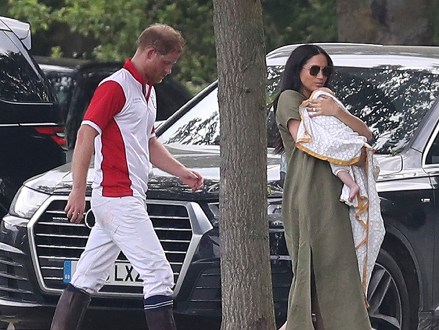 Britain's Prince Harry and Meghan, Meghan Duchess of Sussex walk with their son Archie, at the Royal Charity Polo Day at Billingbear Polo Club, Wokingham, England
Royals, Wokingham, United Kingdom - 10 Jul 2019