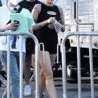 Miley Cyrus wears a black cutout romper and sips a coconut water as she heads to rehearsal for her New Year's Eve show in Miami