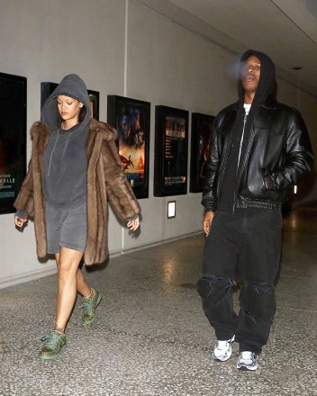 Los Angeles, CA - *EXCLUSIVE* - Movie Night!  Rihanna & boyfriend A$AP Rocky keep a low profile as they step out to enjoy a late night movie date in Los Angeles.  Rihanna rocked a brown fur coat on top of her matching black hoodie and shorts paired with a pair of olive green bedazzled Nike Dunk shoes.  A$AP Rocky kept it casual in an all black ensemble.  The two love birds were escorted by their bodyguard.  Pictured: Rihanna, A$AP Rocky BACKGRID USA 29 DECEMBER 2022 BYLINE MUST READ: SBNYP / BACKGRID USA: +1 310 798 9111 / usasales@backgrid.com UK: +44 208 344 2007 / uksales@backgrid.com *UK Clients - Pictures Containing Children Please Pixelate Face Prior To Publication*