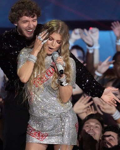 Jack Harlow, background, and Fergie perform "First Class" at the MTV Video Music Awards at the Prudential Center, in Newark, N.J2022 MTV Video Music Awards - Show, Newark, United States - 28 Aug 2022