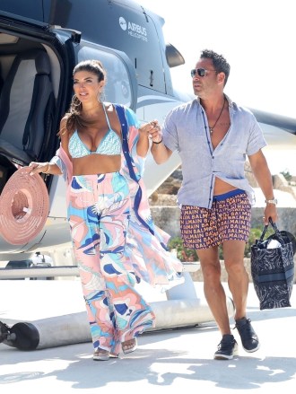 Mykonos, GREECE - *EXCLUSIVE* - Newlyweds The Real Housewives of New Jersey Original Cast Teresa Giudice and husband Luis 'Louie' Ruelas are pictured traveling in style as they are seen enjoying a Helicopter Ride on their honeymoon in Mykonos.  **SHOOT ON 14/08/2022** Pictured: Teresa Giudice, Luis 'Louie' Ruelas BACKGRID USA 22 AUGUST 2022 USA: +1 310 798 9111 / usasales@backgrid.com UK: +44 208 344 uks20sales.com *UK customers - images containing children please pixelate face before publishing*