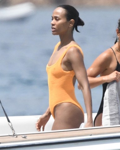 Sardinia, ITALY  - *EXCLUSIVE*  - Actress Zoe Saldana with her husband Marco Perego and their children, enjoy a swim in the Pevero beach in Sardinia, before getting back on their yacht and continuing the cruise in the beautiful Italian seas.Zoe looked sexy showing off her figure wearing her striking orange swimsuit.Pictured: Zoe SaldanaBACKGRID USA 23 JULY 2023 BYLINE MUST READ: FREZZA LA FATA - COBRA TEAM / BACKGRIDUSA: +1 310 798 9111 / usasales@backgrid.comUK: +44 208 344 2007 / uksales@backgrid.com*UK Clients - Pictures Containing ChildrenPlease Pixelate Face Prior To Publication*