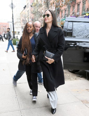 Angelina Jolie And Her Daughter Shopping In New York City Pictured: Angelina Jolie,Zahara Marley Jolie-Pitt Ref: SPL5514331 110123 NON-EXCLUSIVE Picture by: Elder Ordonez / SplashNews.com Splash News and Pictures USA: +1 310-525-5808 London : +44 (0)20 8126 1009 Berlin: +49 175 3764 166 photodesk@splashnews.com World Rights, No Poland Rights, No Portugal Rights, No Russia Rights