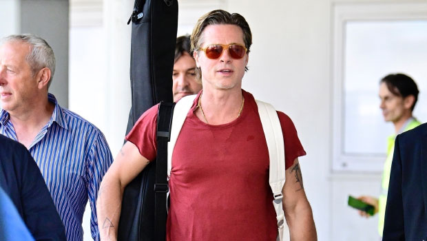 Brad Pitt Wears Rainbow Sneakers and Guitar Ahead of Venice Film Festival Appearance