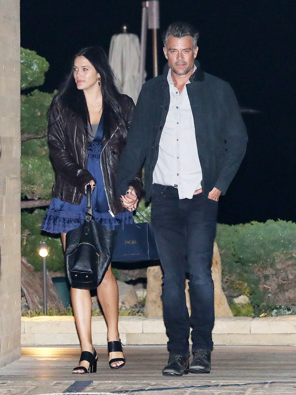 Josh Duhamel and Audra Mari walk hand in hand as they leave Nobu Malibu after having dinner