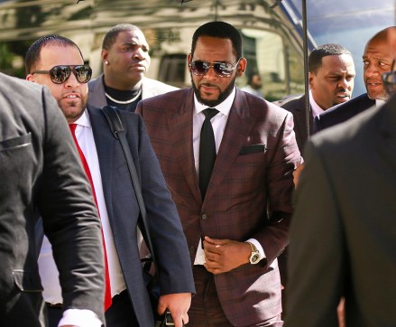 R&B singer R. Kelly, center, arrives at the Leighton Criminal Court building for an arraignment on sex-related felonies in Chicago
R Kelly, Chicago, USA - 26 Jun 2019
