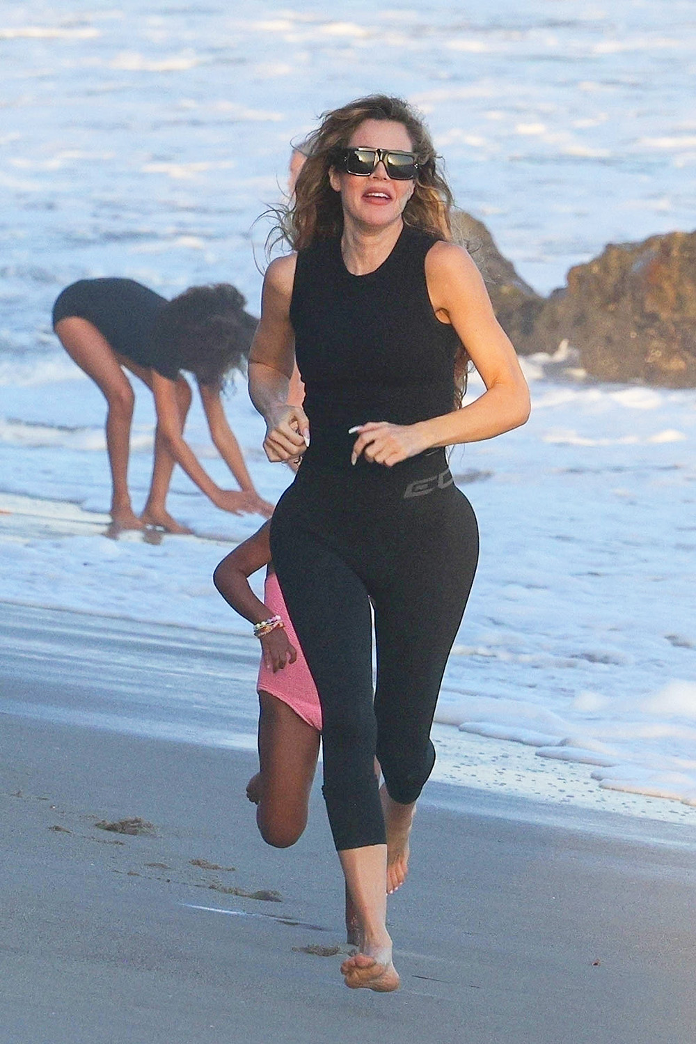 Celebrities Working Out On The Beach Photos image
