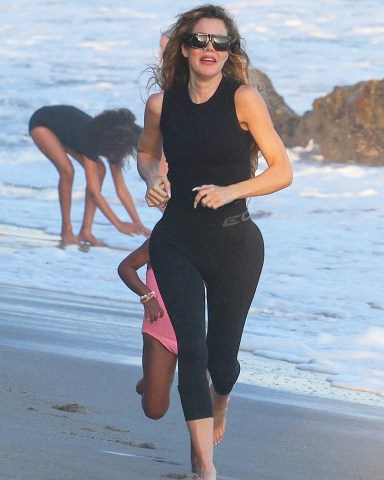 Malibu, CA  - *EXCLUSIVE*  - Keeping up with the Kiddos! Auntie Khloe Kardashian tries to keep up as she spends the day running around and playing with her daughter True Thompson and the Kardashian kids at Malibu beach. Khloe showed off her very thin frame in a pair of black leggings and black sleeveless top for the outing.Pictured: Khloe KardashianBACKGRID USA 6 SEPTEMBER 2022 USA: +1 310 798 9111 / usasales@backgrid.comUK: +44 208 344 2007 / uksales@backgrid.com*UK Clients - Pictures Containing ChildrenPlease Pixelate Face Prior To Publication*