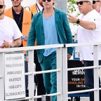 Brad Pitt exits the Venice Airport with friends during his time at the 79th Venice Film Festival