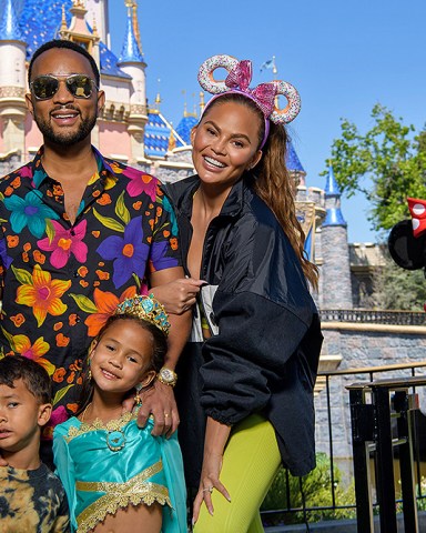 Chrissy Teigen, John Legend and their kids, Luna and Miles, pose with Minnie Mouse while celebrating Luna's birthday at Disneyland Park in Anaheim, Calif., April 14, 2022. The family enjoyed multiple attractions, including a voyage on 'it's a small world', complete with a cast of nearly 300 audio-animatronics dolls representing children from every corner of the globe singing the classic anthem.
Chrissy Teigen and John Legend celebrate Daughter Luna's Birthday at Disneyland Resort, Anaheim, California, USA - 14 Apr 2022
