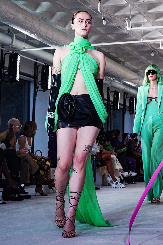 https://hollywoodlife.com/wp-content/uploads/2022/09/ella-emhoff-wears-nothing-underneath-green-top-on-nyfw-runway-ss-embed.jpg