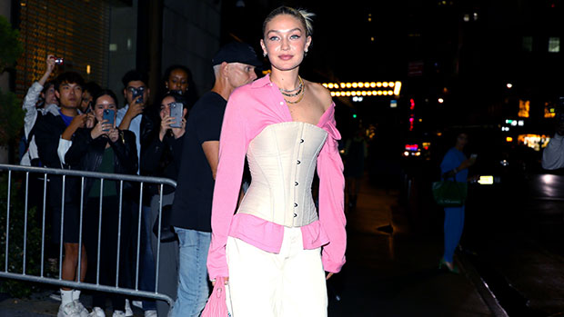 Gigi Hadid displays slim waist in corset and high-waist slacks