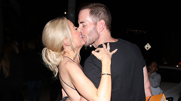 Heather Rae Young covers Baby Bump in a black lace dress as she kisses Tarek El Moussa