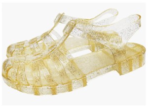 A pair of gold jelly sandals.