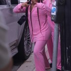 Kim Kardashian wears custom pink sleepwear outfit as she matches her daughter North and sister Kourtney as they celebrate on a party bus for her 10th birthday in LA