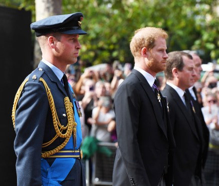 Prince William, Prince of Wales and Prince Harry, Duke of Sussex walk behind the coffin during the procession for the Lying-in State of Queen Elizabeth II on September 14, 2022 in London, England. Queen Elizabeth II II's coffin is taken in procession on a Gun Carriage of The King's Troop Royal Horse Artillery from Buckingham Palace to Westminster Hall where she will lay in state until the early morning of her funeral. Queen Elizabeth II died at Balmoral Castle in Scotland on September 8, 2022, and is succeeded by her eldest son, King Charles III.
The Coffin Carrying Queen Elizabeth II Is Transferred From Buckingham Palace To The Palace Of Westminster, London, UK - 14 Sep 2022