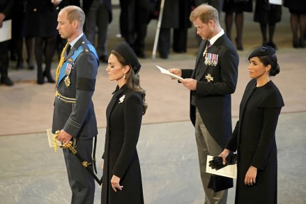 Britain's Prince William, left, Kate, Princess of Wales, second left, Prince Harry, and his wife Meghan, the Duchess of Sussex, right, pay their respects to Queen Elizabeth II as the coffin rests in Westminster Hall for her Lying-in State, in London
Royals, London, United Kingdom - 14 Sep 2022