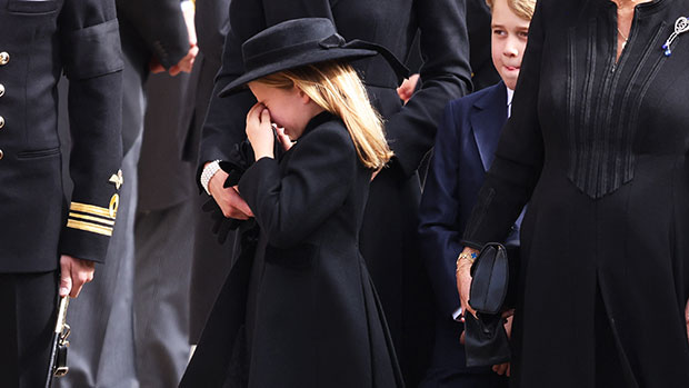 Princess Charlotte cries and is comforted by her mother Kate Middleton at Queen's funeral