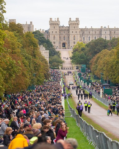 Mourners line the route of Queen Elizabeth II's funeral procession on the Long Walk at Windsor Castle, Britain, 19 September 2022. The late Queen Elizabeth II will be buried inside the King George VI Memorial Chapel within St George's Chapel at Windsor alongside her late husband the Duke of Edinburgh. Britain's Queen Elizabeth II died at her Scottish estate, Balmoral Castle, on 08 September 2022. The 96-year-old Queen was the longest-reigning monarch in British history.
The Funeral of Queen Elizabeth II, Windsor, United Kingdom - 19 Sep 2022