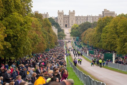 Mourners line the route of Queen Elizabeth II's funeral procession on the Long Walk at Windsor Castle, Britain, 19 September 2022. The late Queen Elizabeth II will be buried inside the King George VI Memorial Chapel within St George's Chapel at Windsor alongside her late husband the Duke of Edinburgh.  Britain's Queen Elizabeth II died at her Scottish estate, Balmoral Castle, on 08 September 2022. The 96-year-old Queen was the longest history-reigning monarch in British.  The Funeral of Queen Elizabeth II, Windsor, United Kingdom - 19 Sep 2022