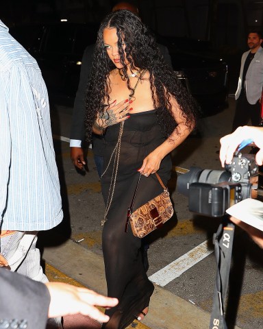 Miami, FL  - Rihanna & ASAP Rocky step out for a romantic date night at South beach's Carbone restaurant in the midst of the star-studded Art Basel weekend in Miami, Florida. Rihanna wasn't shy to put her assets on display as she donned a sheer black maxi dress. ASAP made a bold impression by rocking a blue Gucci beanie and blue elements to match.Pictured: Rihanna, ASAP RockyBACKGRID USA 3 DECEMBER 2022 BYLINE MUST READ: BlayzenPhotos / BACKGRIDUSA: +1 310 798 9111 / usasales@backgrid.comUK: +44 208 344 2007 / uksales@backgrid.com*UK Clients - Pictures Containing ChildrenPlease Pixelate Face Prior To Publication*