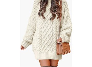 A woman wearing a beige sweater dress.