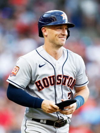 Houston Astros' Alex Bregman walks to first base against the Cleveland Guardians during the third inning of a baseball game, in Cleveland
Astros Guardians Baseball, Cleveland, United States - 05 Aug 2022